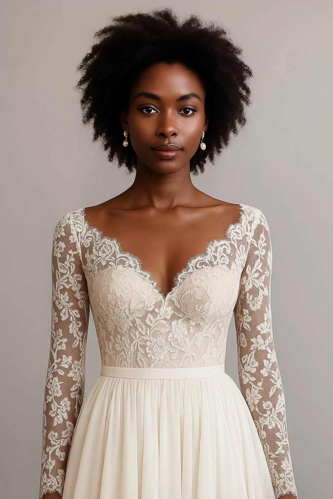 Detailed view of lace bodice and sheer sleeves of Luna Fiorita wedding gown